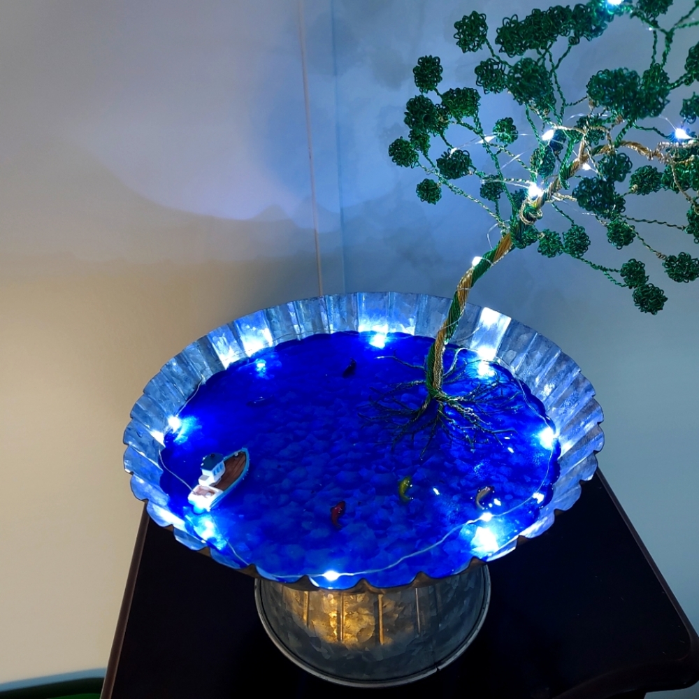 Wire tree on tin with lights
